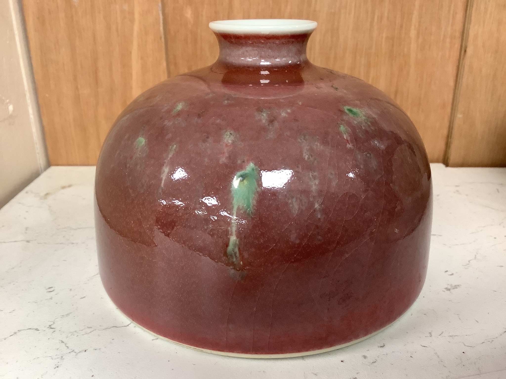 A Chinese ox-blood water pot, height 9cm